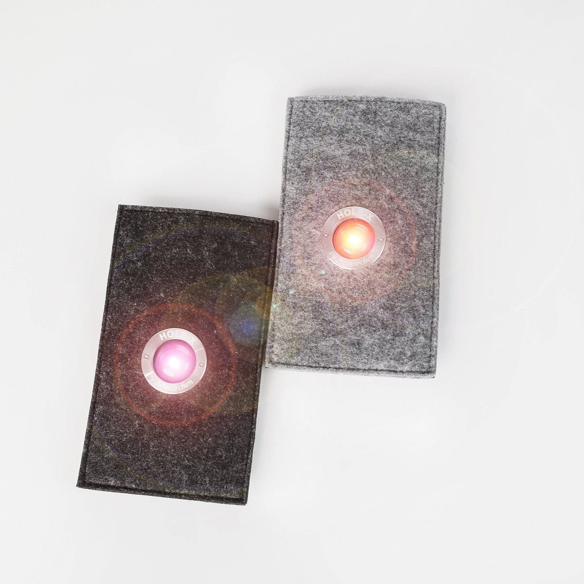 HOLE-X HOTEL Handyhülle universal Filz schwarz Bringe Deine Tasche zum Leuchten mit Deinem Smartphone Smartphonetasche Bullauge Innovation - HOLE-X-WORLD